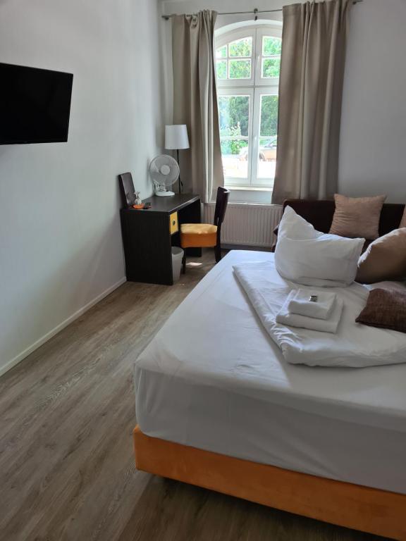 Postel nebo postele na pokoji v ubytování Perle Hotel