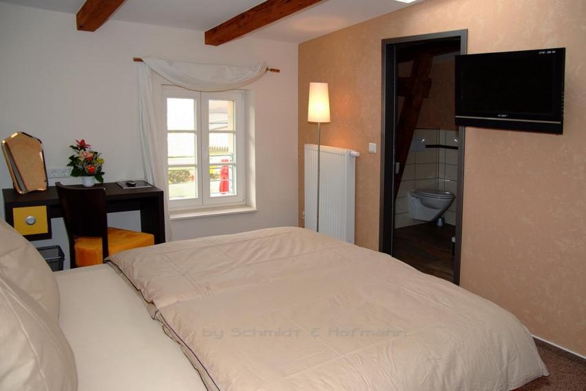 Postel nebo postele na pokoji v ubytování Perle Hotel