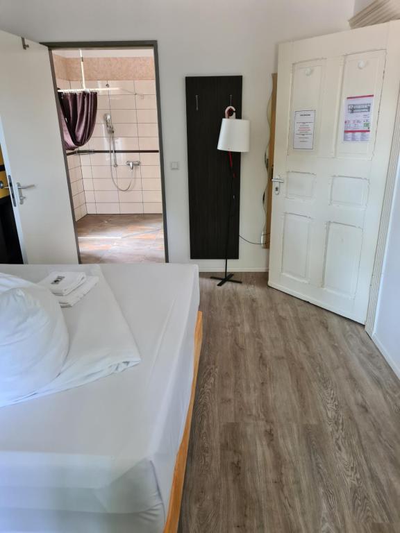 Postel nebo postele na pokoji v ubytování Perle Hotel