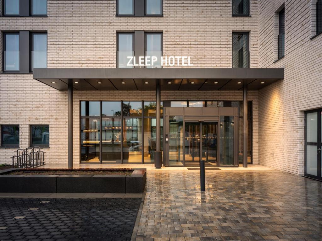 a building with the entrance to a keep depot at Zleep Hotel Frankfurt Airport Kelsterbach in Kelsterbach