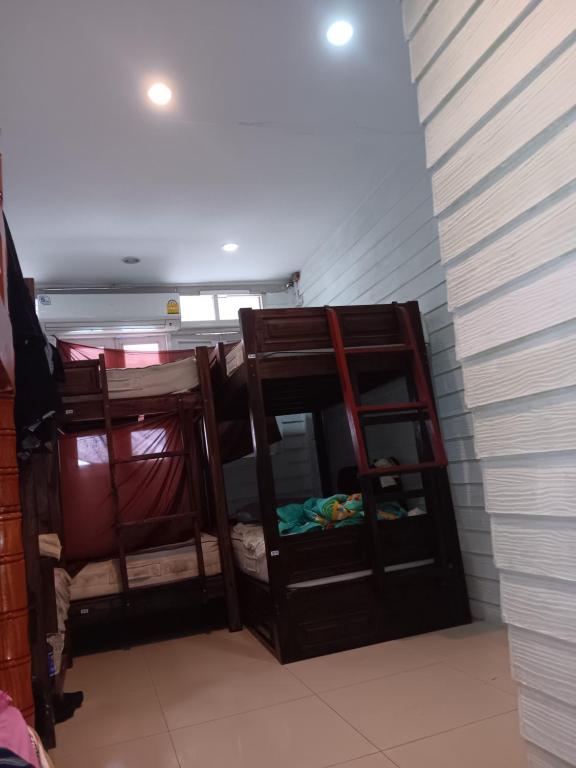 a room with two bunk beds in a room at New Masala Indian restaurant in Bangkok