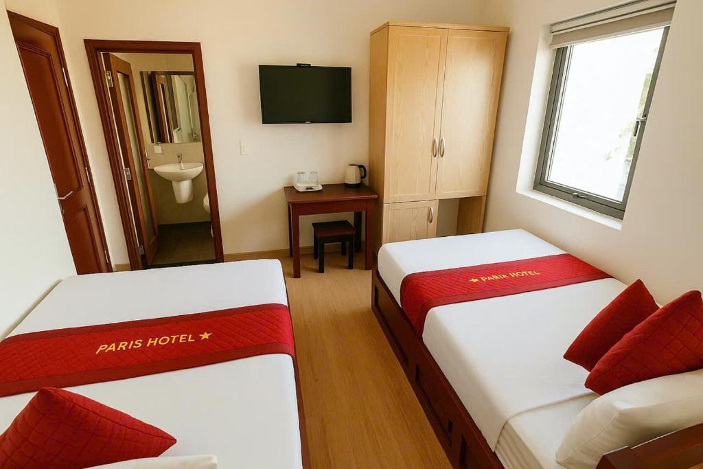 Postel nebo postele na pokoji v ubytování Stars Central Danang