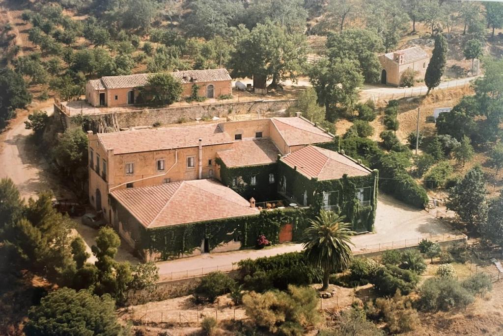 an aerial view of a house with a palm tree at Villa Pietralunga Suite in Nicosia