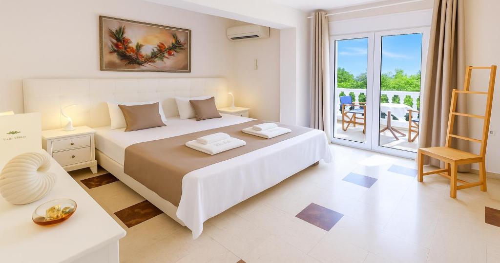 Postel nebo postele na pokoji v ubytování Villa Small Paradise