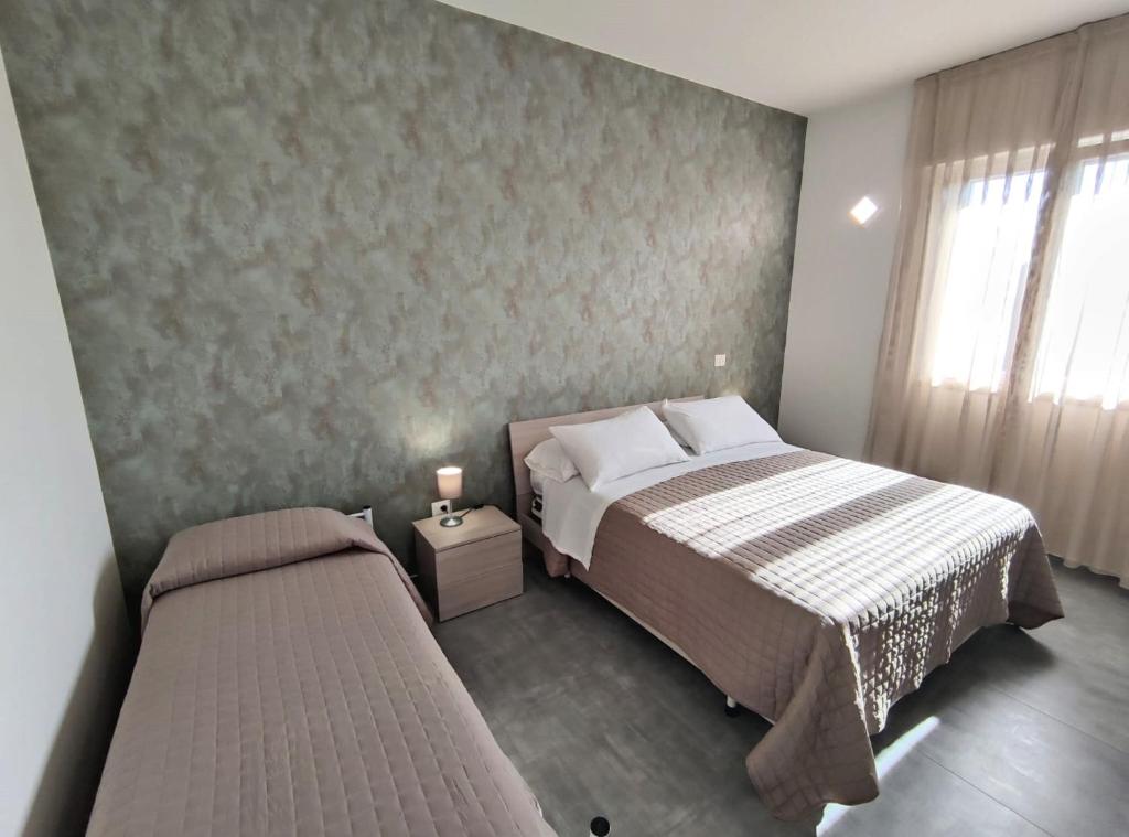 Postel nebo postele na pokoji v ubytování Hotel Bastione