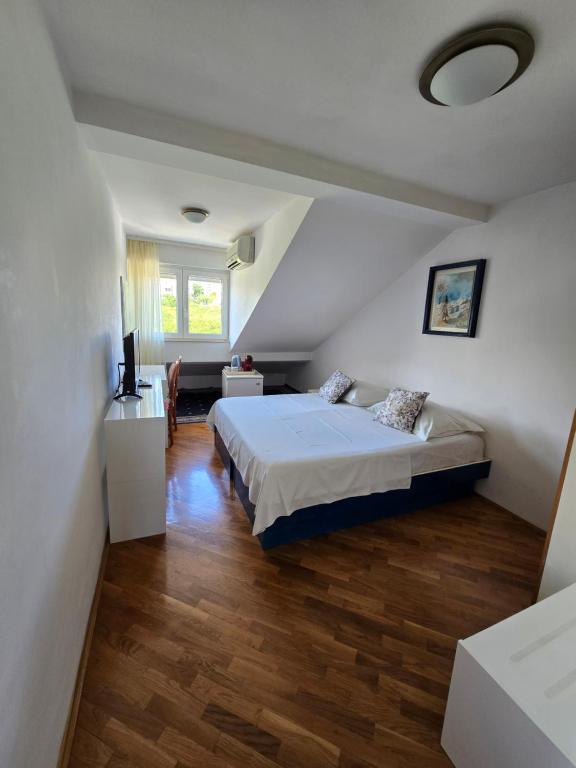 Postel nebo postele na pokoji v ubytování Rooms Lux