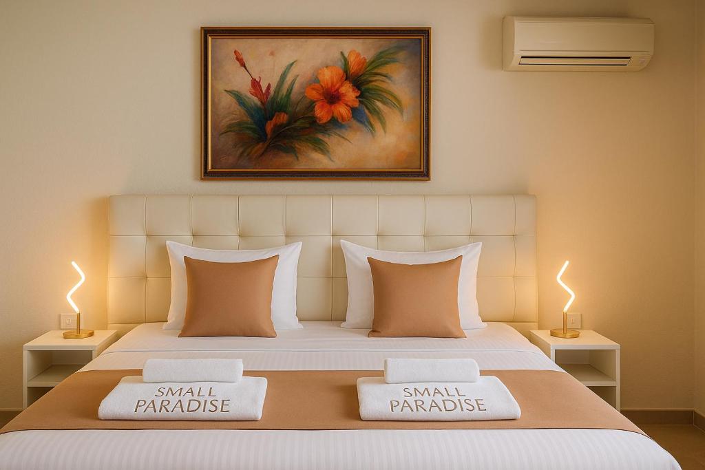 Postel nebo postele na pokoji v ubytování Villa Small Paradise