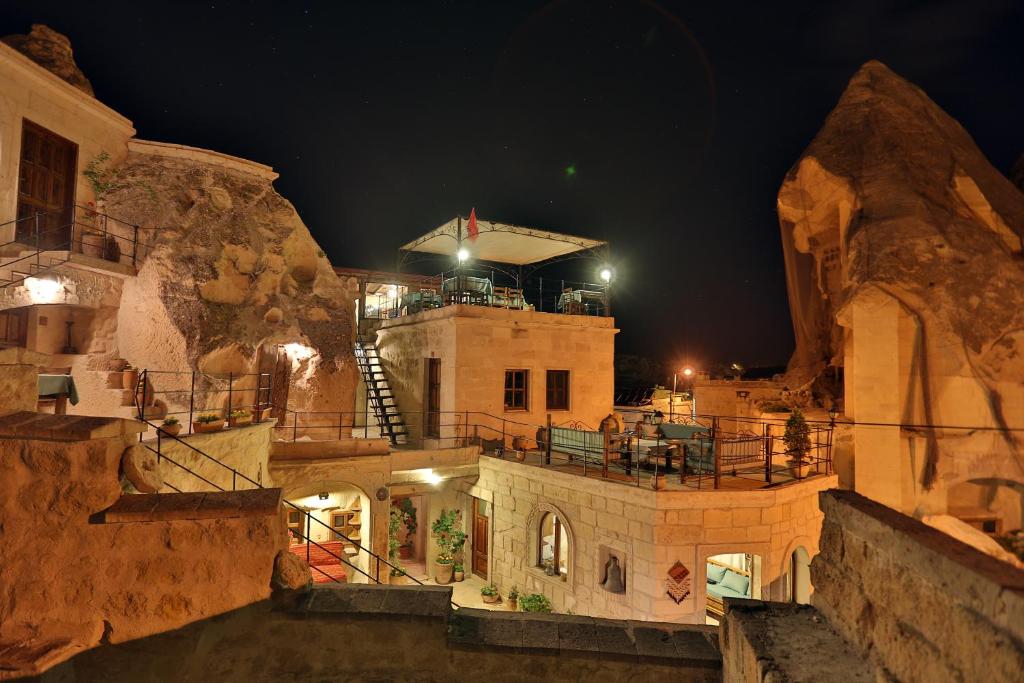 a view of a building at night at Turquaz Cave Hotel in Göreme