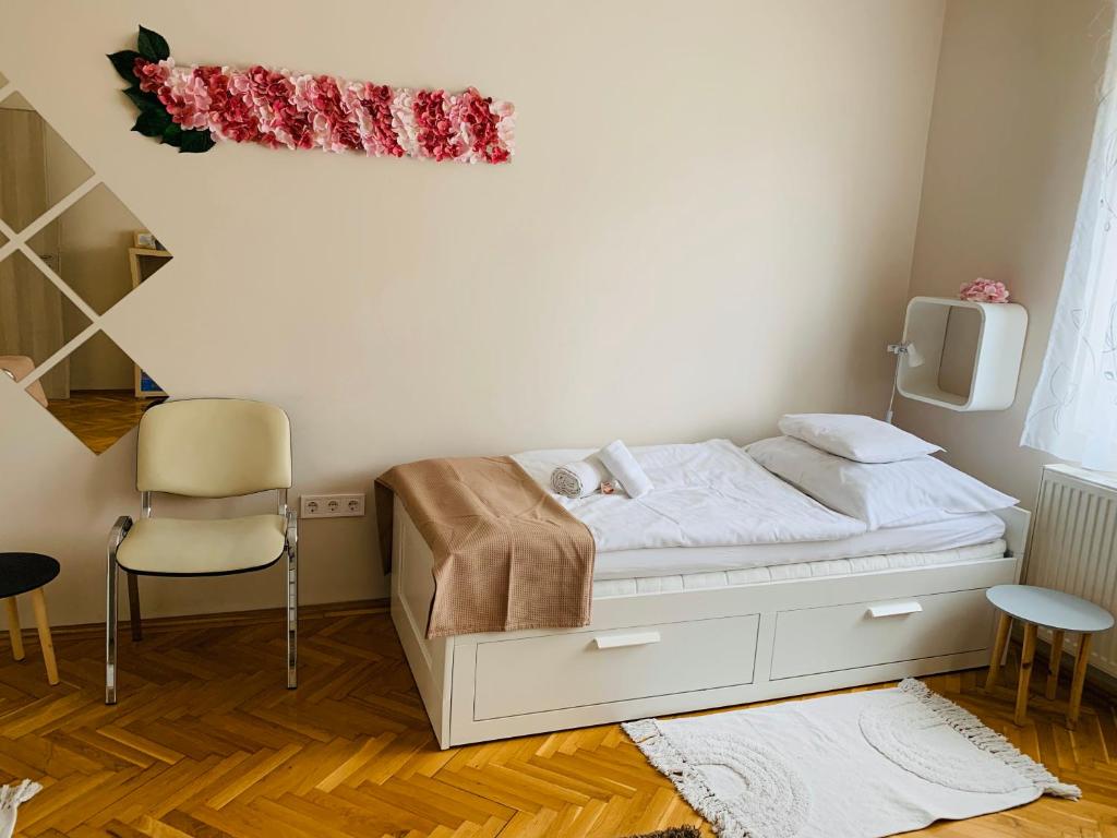 Postel nebo postele na pokoji v ubytování Hortenzia Vendégház Mór