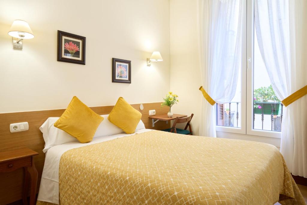 Cama o camas de una habitación en Pensión San Jerónimo