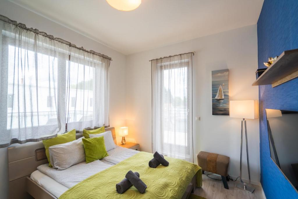 Posteľ alebo postele v izbe v ubytovaní Fox apartman A11