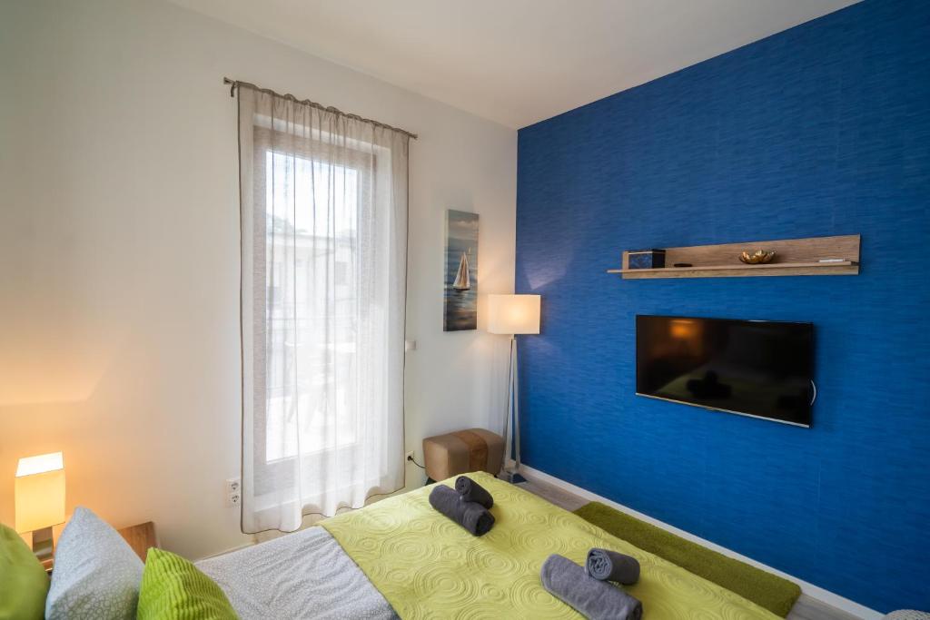 Posteľ alebo postele v izbe v ubytovaní Fox apartman A11