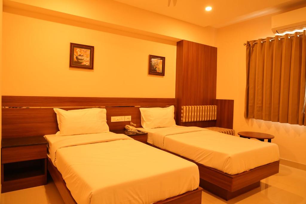 Postel nebo postele na pokoji v ubytování Hotel Le Palace