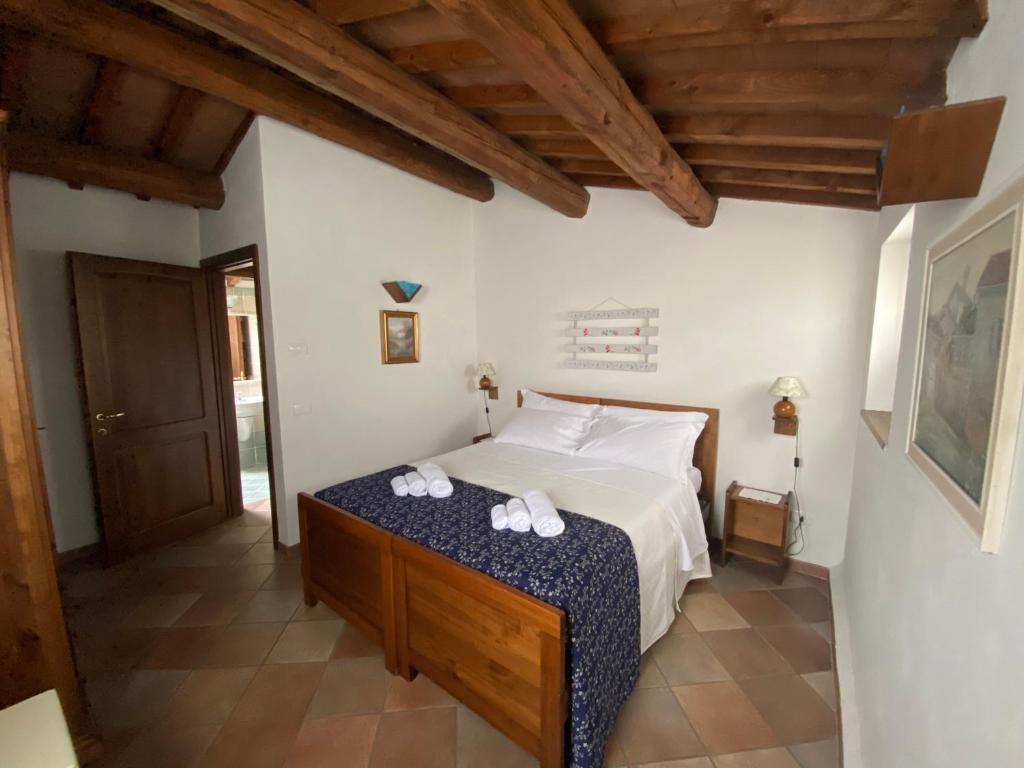 Postel nebo postele na pokoji v ubytování Antico Borgo Carceri & Wellness