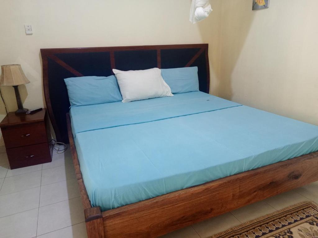 Postel nebo postele na pokoji v ubytování Casa Cacheu Homestay Guest House