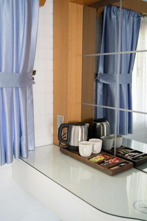 Kuchyň nebo kuchyňský kout v ubytování Azur Hotel