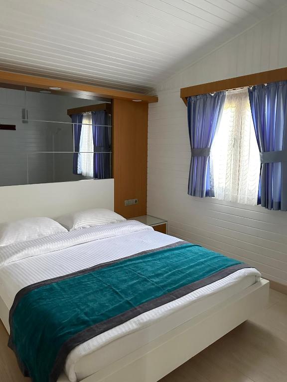 Postel nebo postele na pokoji v ubytování Azur Hotel
