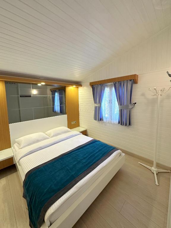 Postel nebo postele na pokoji v ubytování Azur Hotel