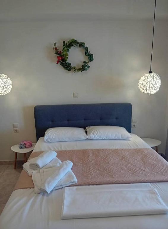 Postel nebo postele na pokoji v ubytování Hotel Assini Beach Tolo