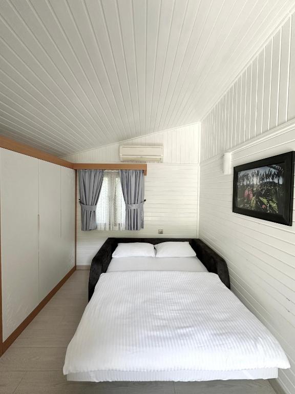 Postel nebo postele na pokoji v ubytování Azur Hotel