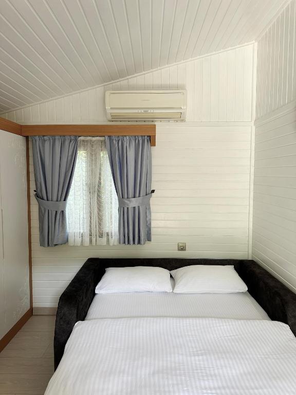 Postel nebo postele na pokoji v ubytování Azur Hotel