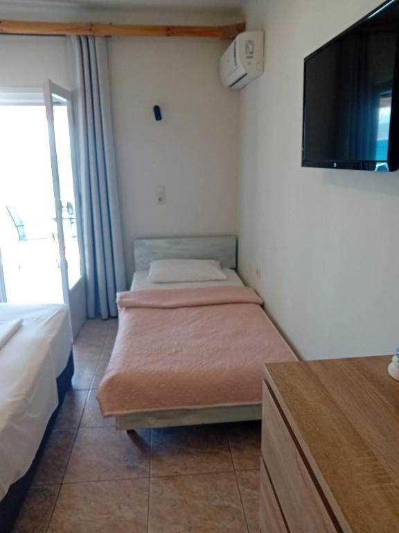Postel nebo postele na pokoji v ubytování Hotel Assini Beach Tolo