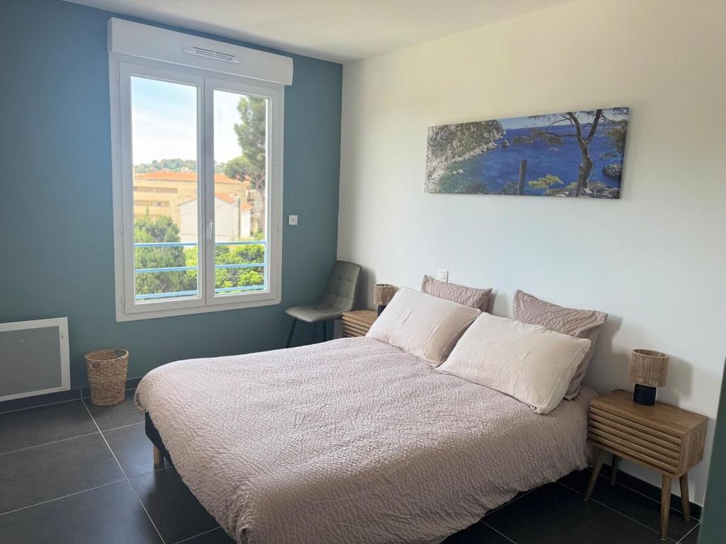 En eller flere senge i et værelse på Bel Appartement Tout Neuf