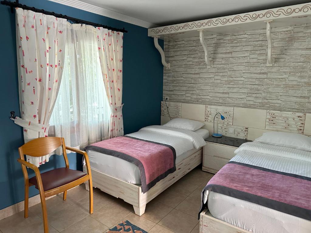 Postel nebo postele na pokoji v ubytování Azur Hotel