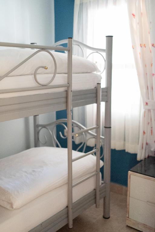 Postel nebo postele na pokoji v ubytování Azur Hotel