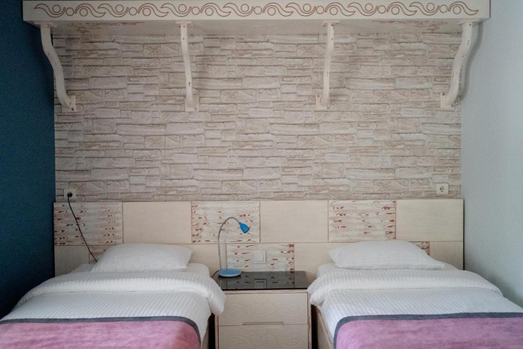 Postel nebo postele na pokoji v ubytování Azur Hotel
