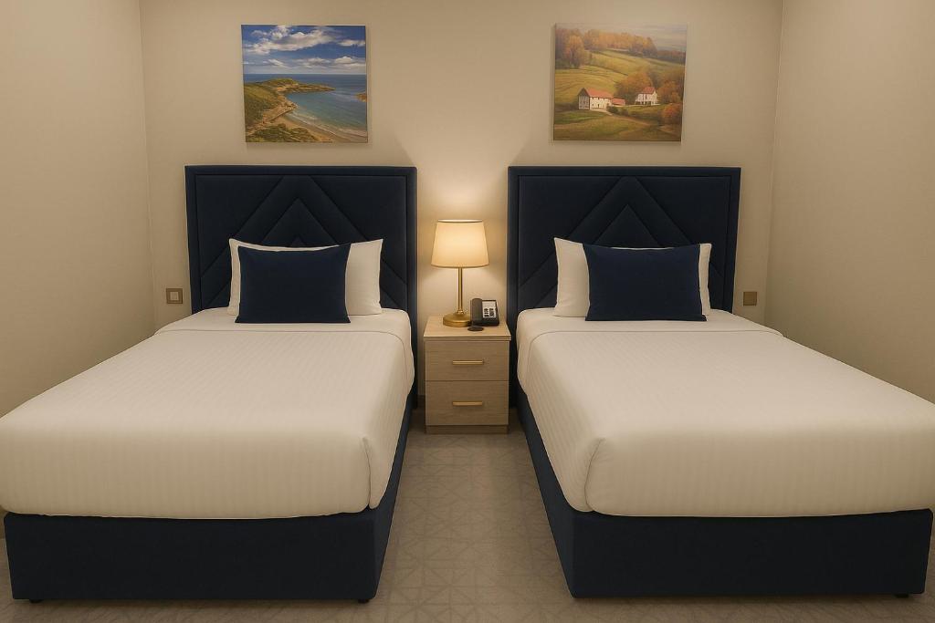 Letto o letti in una camera di Saraya Palace Hotel