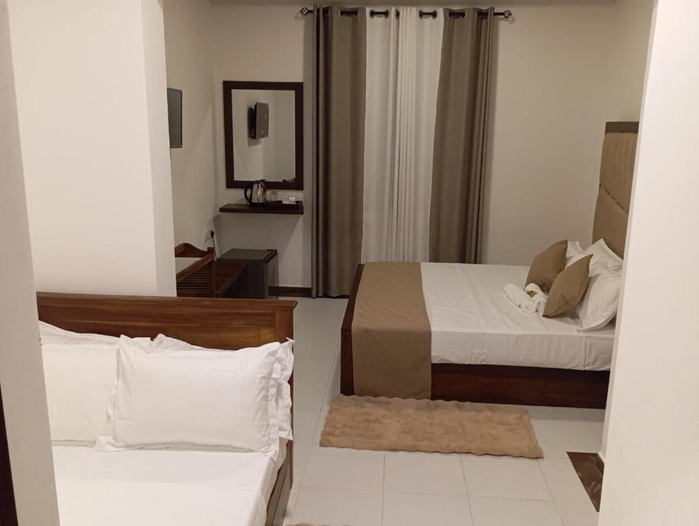 Postel nebo postele na pokoji v ubytování Knuckles View Hotel