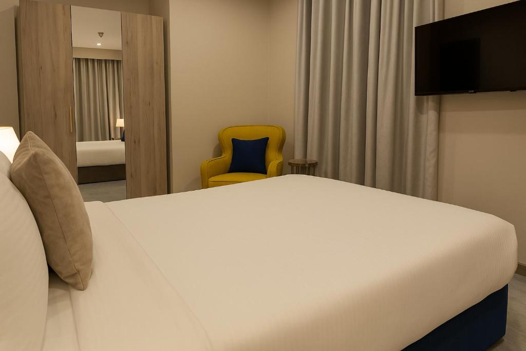 Letto o letti in una camera di Saraya Palace Hotel