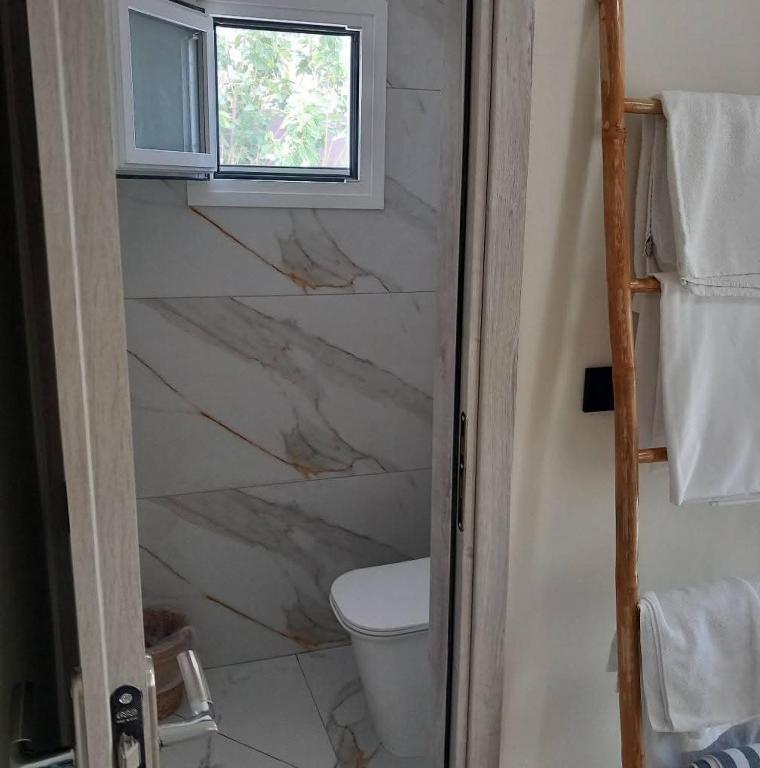 Koupelna v ubytování Hotel Assini Beach Tolo