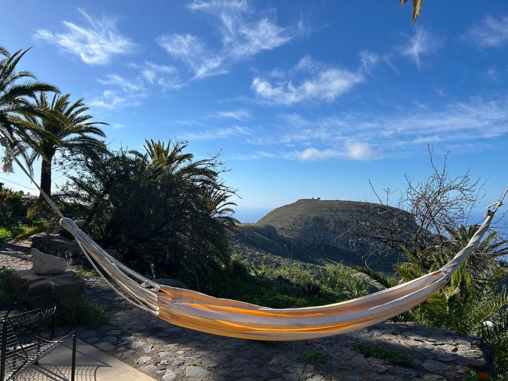 a hammock with a view of a mountain at Casa Buenavida in Alajeró
