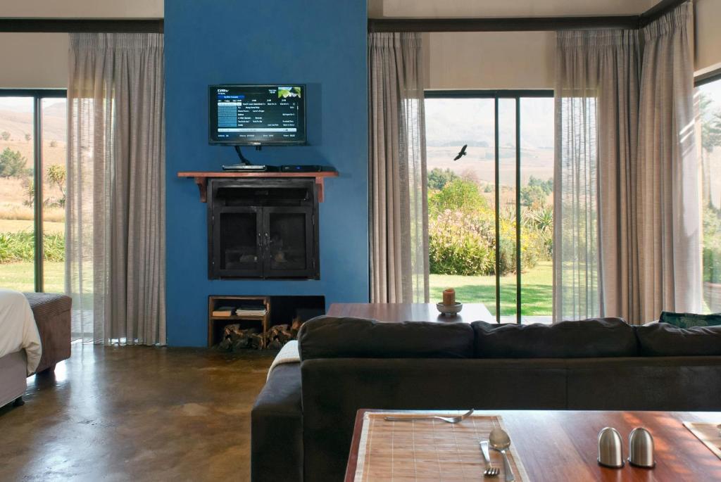 TV a/nebo společenská místnost v ubytování Ama Casa Cottages