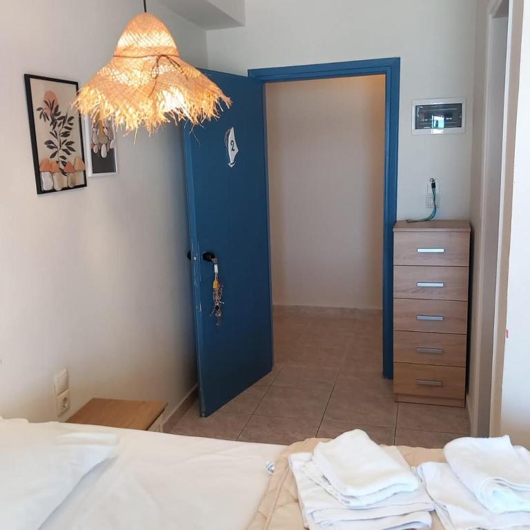 Postel nebo postele na pokoji v ubytování Hotel Assini Beach Tolo
