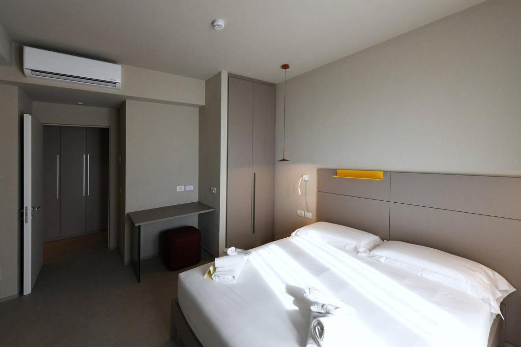Postel nebo postele na pokoji v ubytování Hotel Villa Cappugi