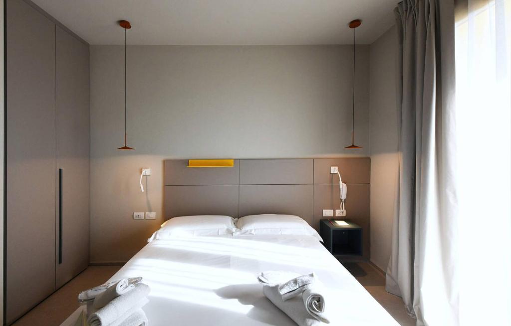 Postel nebo postele na pokoji v ubytování Hotel Villa Cappugi