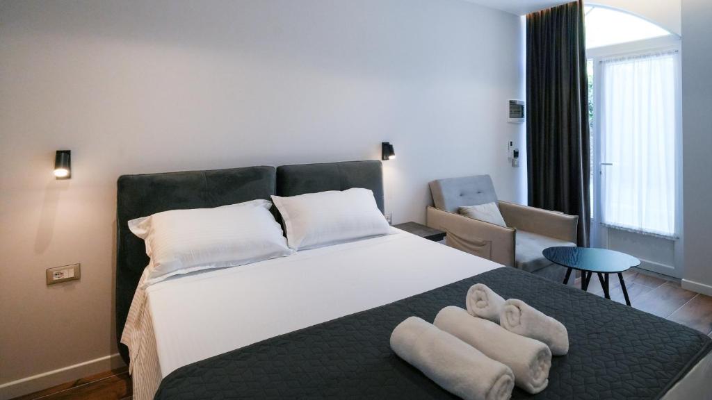 Postel nebo postele na pokoji v ubytování Hotel LUMINOSA