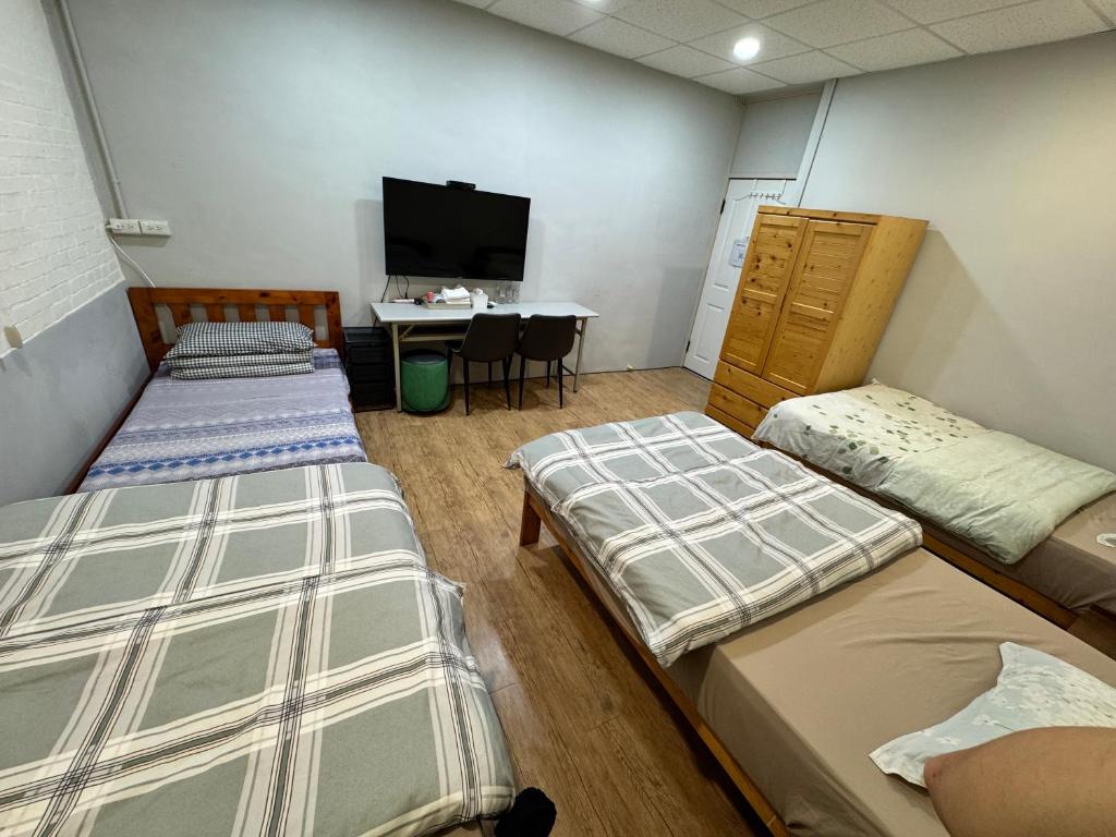 Postel nebo postele na pokoji v ubytování 彰濱伸港民宿