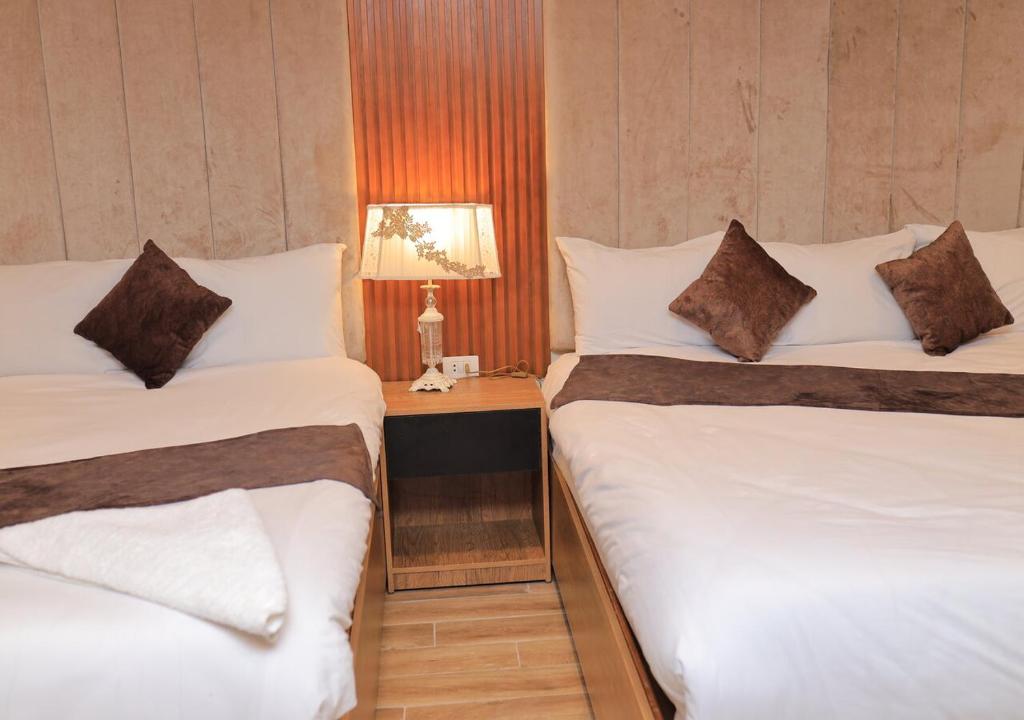 Postel nebo postele na pokoji v ubytování The Muse Luxury View Hotel
