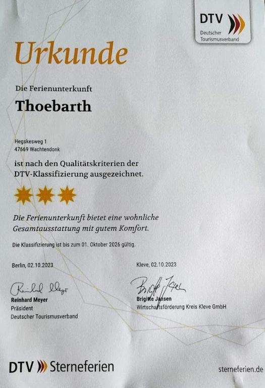 a white envelope with a piece of paper at Ferienwohnung Thoebarth in Wachtendonk