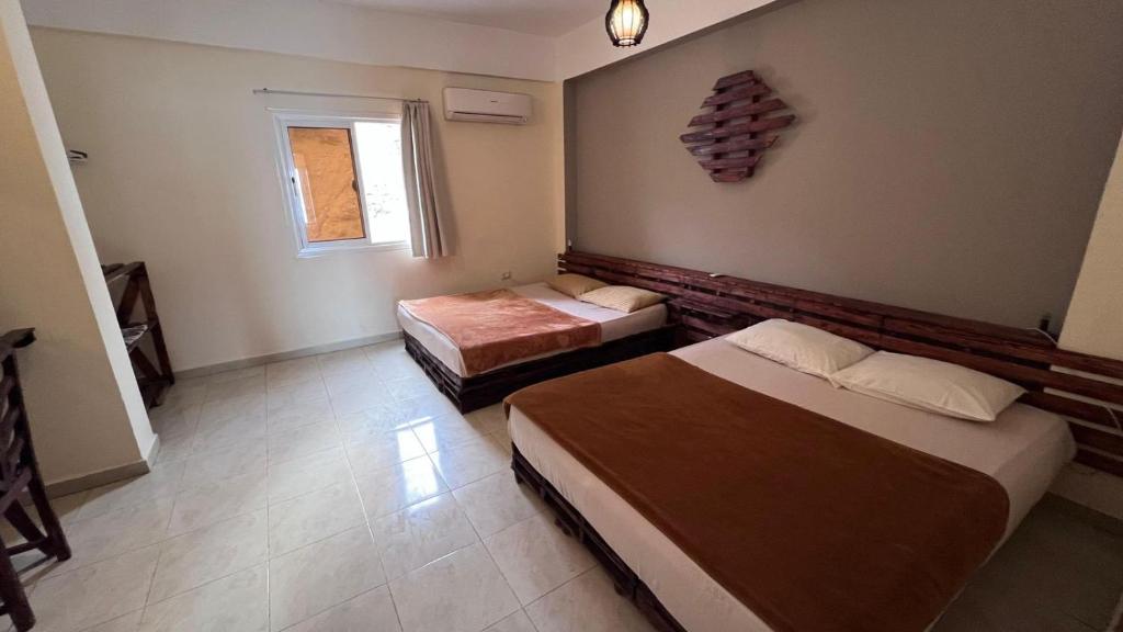 Postel nebo postele na pokoji v ubytování Locanda Dahab