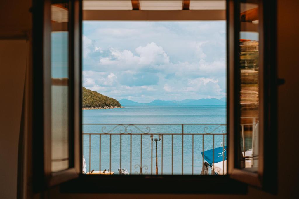 a view of the ocean from a window at Sivota Seafront Studios in Sivota