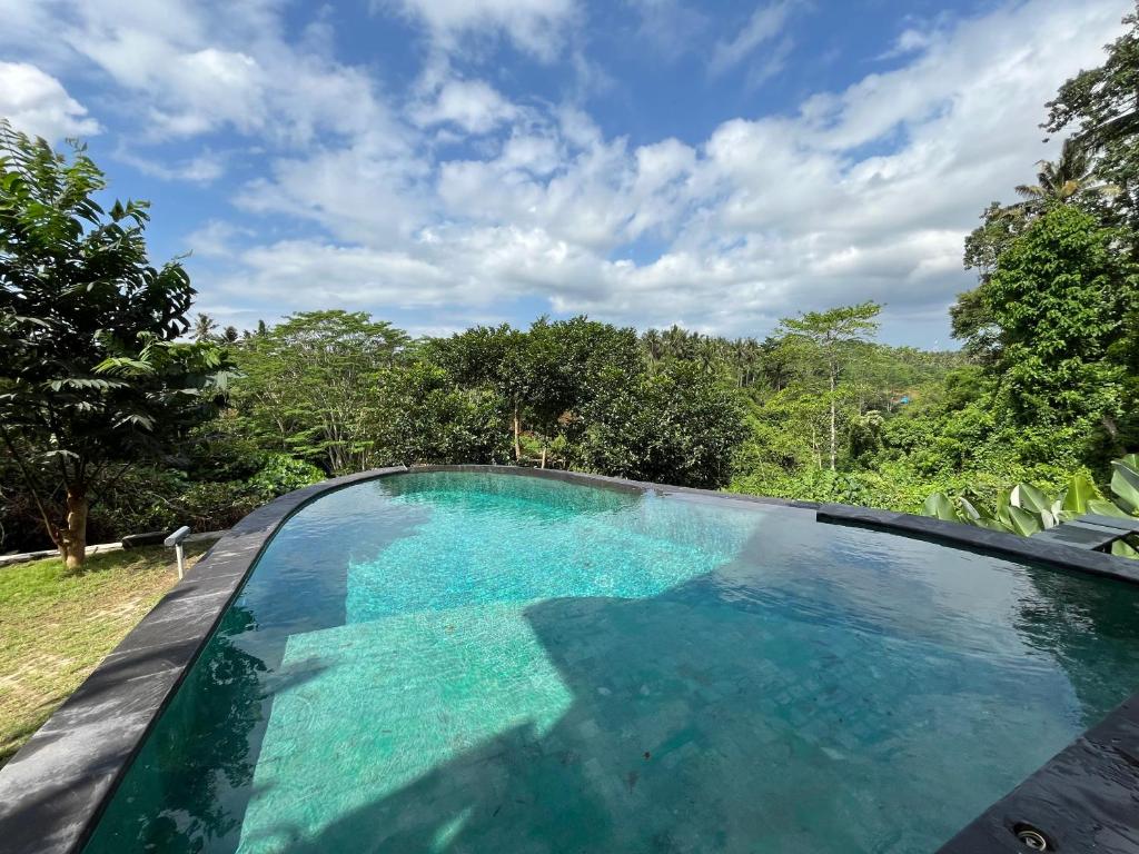 Bazén v ubytování D'Nanda mini hotel Ubud nebo v jeho okolí