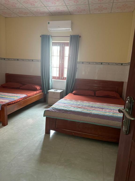 Postel nebo postele na pokoji v ubytování San Vuon Guesthouse