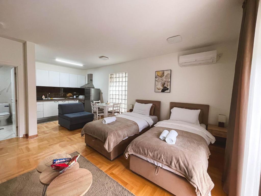 Postel nebo postele na pokoji v ubytování Apartmani TEO