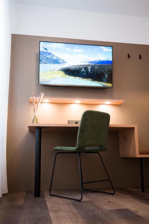 TV a/nebo společenská místnost v ubytování Hotel Sandkorn