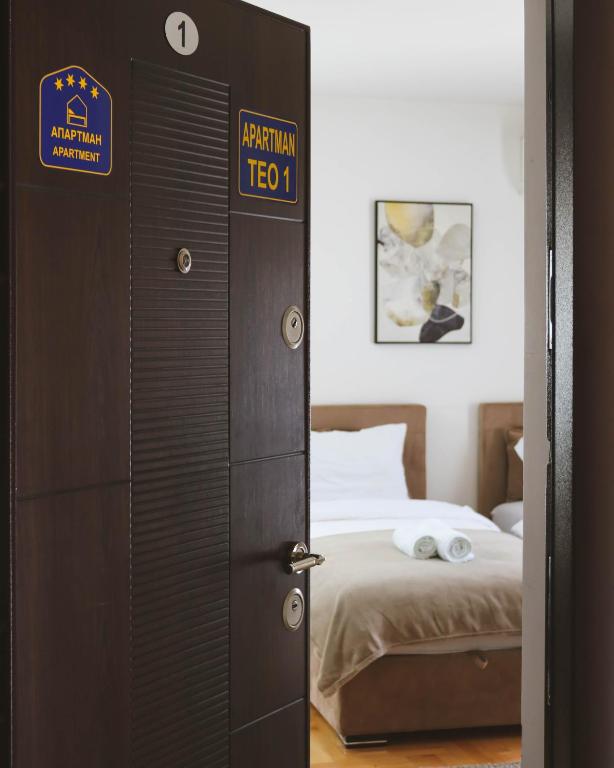 Postel nebo postele na pokoji v ubytování Apartmani TEO